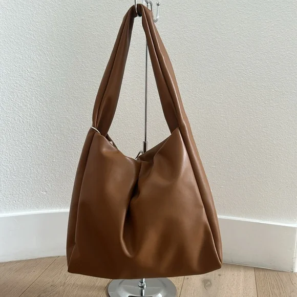 Tan bag with silver zipper in front of - Picture 4 of 5